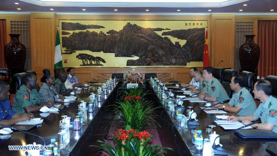 Chinese State Councilor and Defense Minister Chang Wanquan (3rd R) meets with Nigerian Minister of State for Defense Olusola Obada (3rd L) in Beijing, capital of China, July 10, 2013. (Xinhua/Zhang Duo)