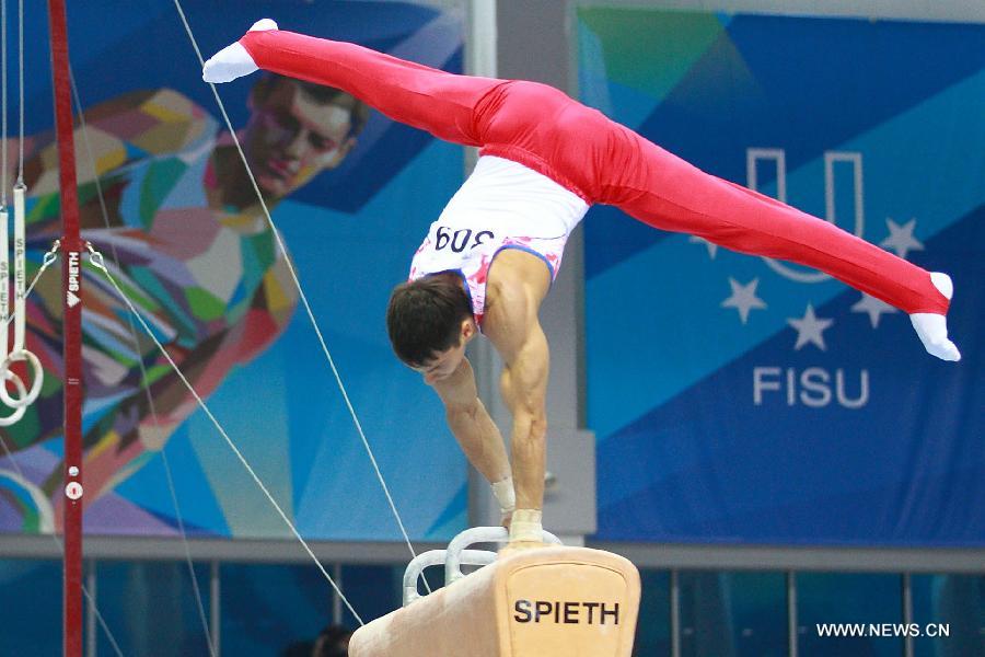 Nikolai Kuksenkov of Russia competes during the men's pommel horse final at the 27th Summer Universiade in Kazan, Russia, July 10, 2013. Kuksenkov won the gold medal with 15.050 points. (Xinhua/Ren Yuan)