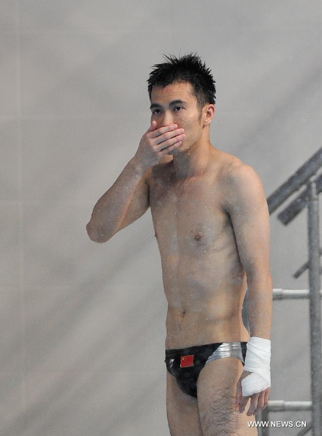 Wu Jun of China reacts during the final of men's 10m platform diving at the 27th Summer Universiade in Kazan, Russia, July 10, 2013. Wu Jun won the silver medal with 520.40. (Xinhua/Kong Hui)