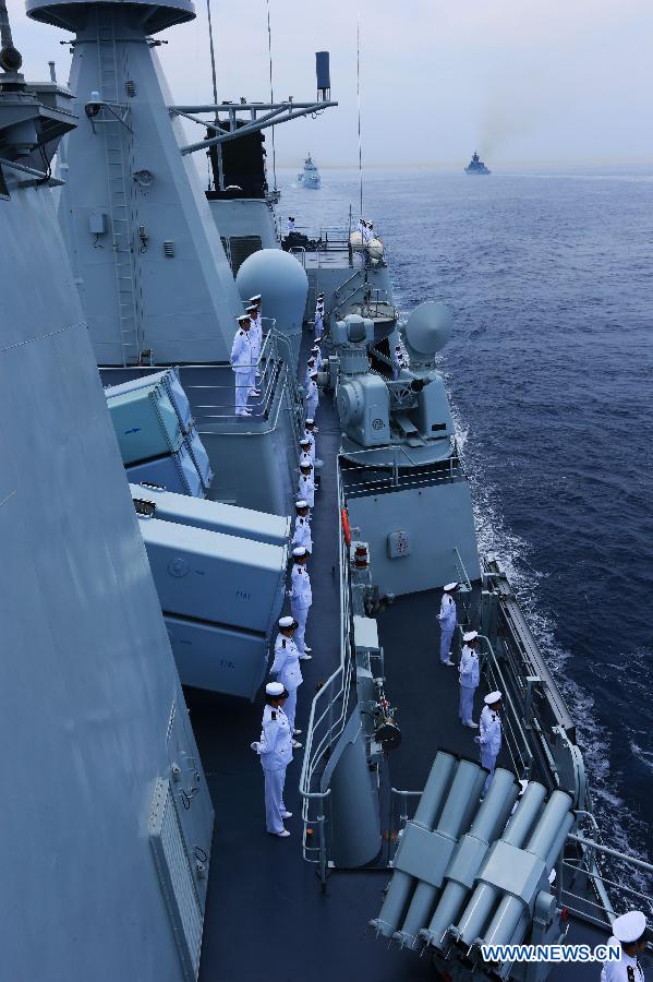 Chinese naval soldiers stand in formation on Shenyang guided missile destroyer during a military review of the "Joint Sea-2013" drill at Peter the Great Bay in Russia, July 10, 2013. The "Joint Sea-2013" drill participated by Chinese and Russian warships concluded here on Wednesday. (Xinhua/Zha Chunming)