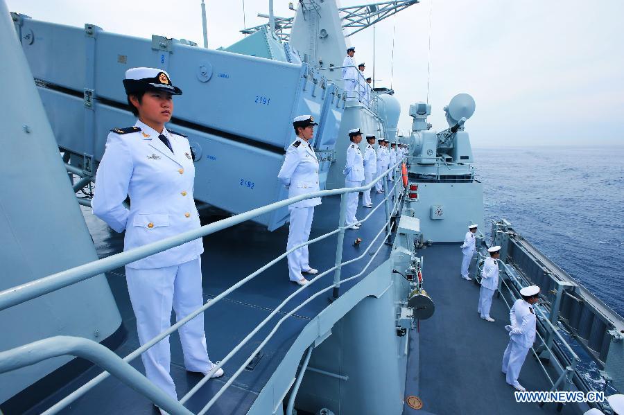 Chinese naval soldiers stand in formation on Shenyang guided missile destroyer during a military review of the "Joint Sea-2013" drill at Peter the Great Bay in Russia, July 10, 2013. The "Joint Sea-2013" drill participated by Chinese and Russian warships concluded here on Wednesday. (Xinhua/Zha Chunming)