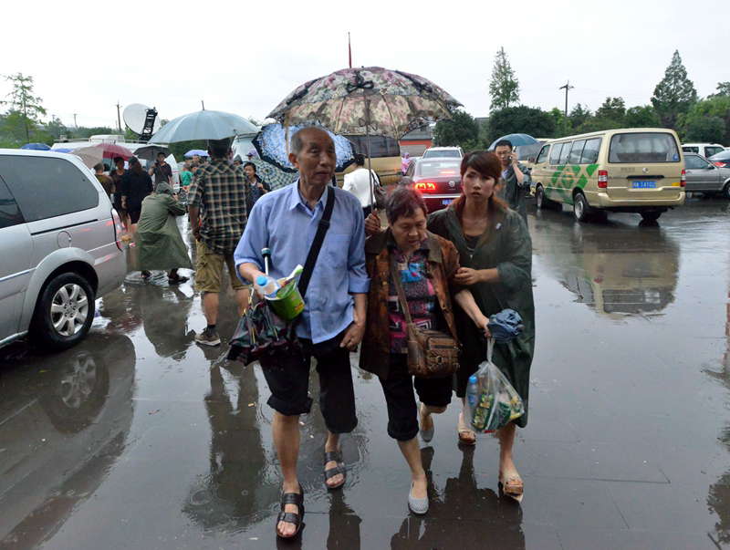 People who had been trapped in flood-hit Zhongxing county in southwest China's Sichuan province have been rescued and relocated. Rain-triggered mountain torrents and landslides buried 11 households, leaving two people dead and 21 missing. As of 9:45 p.m., 352 people stranded have been relocated to safe areas. (Xinhua/Liu Jie)