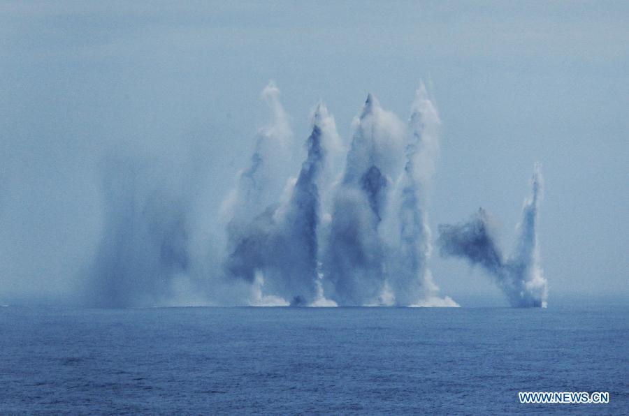 Chinese naval vessel fire anti-submarine missile during the "Joint Sea-2013" drill at Peter the Great Bay in Russia, July 10, 2013. The "Joint Sea-2013" drill participated by Chinese and Russian warships concluded here on Wednesday. (Xinhua/Zha Chunming)