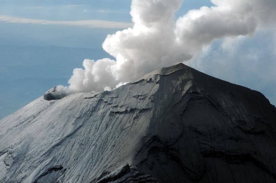 Image provided by the Armed Navy Secretariat of Mexico (SEMAR) shows steam and ash rising from the crater of the Popocatepetl volcano in Puebla, Mexico, on July 10, 2013. According to the lastest report from the National Center for Disaster Prevention, during the last 24 hours there have been 39 moderate exhalations of low magnitude in the volcano, and the volcanic alert remains in Phase 3 yellow. (Xinhua/SEMAR)