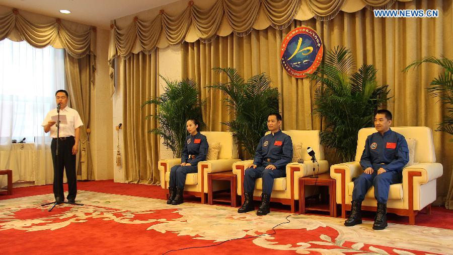 Astronauts of China's Shenzhou-10 mission Nie Haisheng (2nd R), Zhang Xiaoguang (1st R) and Wang Yaping (3rd R) are present at a press conference in Beijing, China, July 11, 2013. The three astronauts have completed their medical quarantine and are in good conditions, according to official sources. (Xinhua/Liu Fang) 