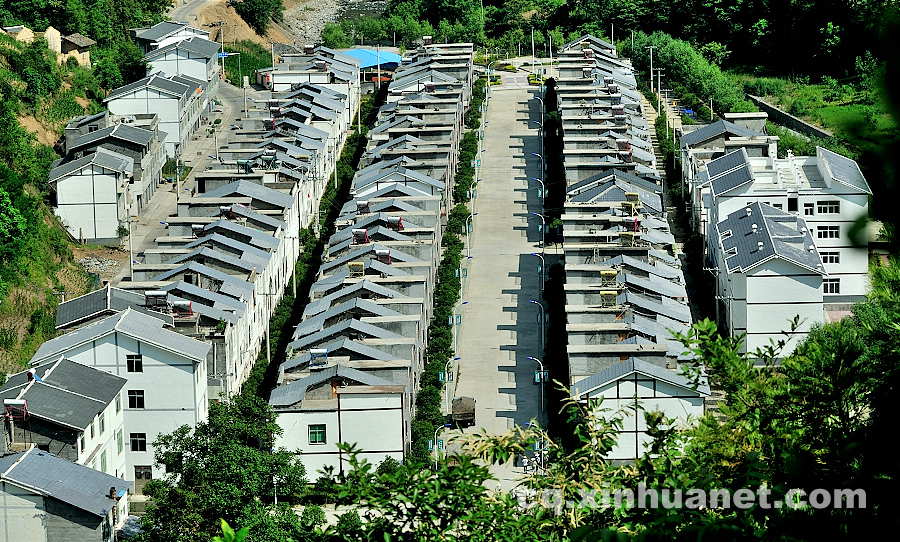 The newly built houses in eco-migration settlement community. The eco-migration project aims to help the poor overcome extreme difficulties in Lantian town, Chengkou county, southwest China’s Chongqing. (Xinhua Photo/ Li Xiangbo)