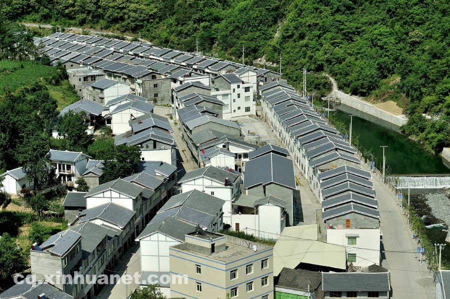 The newly built houses in an eco-migration settlement community. The eco-migration project aims to help the poor overcome extreme difficulties in Lantian town, Chengkou county, southwest China’s Chongqing. (Xinhua Photo/ Li Xiangbo)