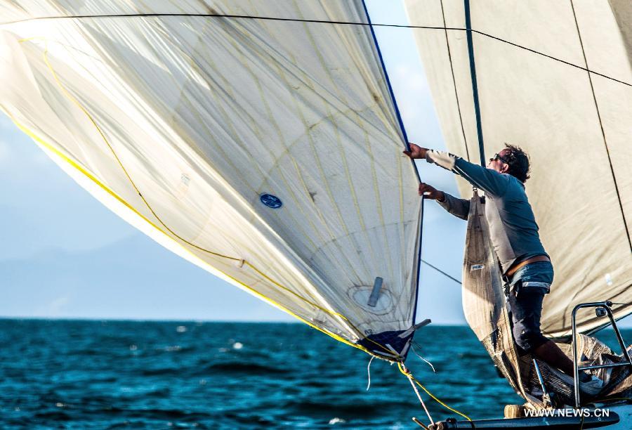 The crew of the vessel "Crioula" participates in the try-out of class S40 during the Ilhabela Sailing Week 2013, in Ilhabela, Brazil, on July 10, 2013. The regatta of Wednesday was a medium path around the Buzios Island, northeast of Ilhabela. (Xinhua/Marcos Mendez)