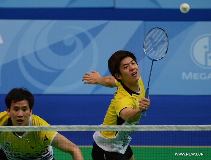 Lee Yong Dae (R) and Ko Sung Hyun of South Korea compete during the men's doubles final match of badminton event against Ivan Sozonov and Vladimir Ivanov of Russia at the 27th Summer Universiade in Kazan, Russia, July 11, 2013. Lee Yong Dae and Ko Sung Hyun won the gold medal with 3-0. (Xinhua/Kong Hui) 