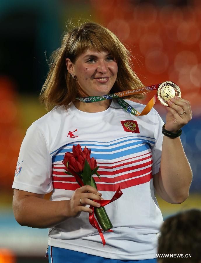 Irina Tarasova of Russia poses during the awarding ceremony after the women's shot put final at the 27th Summer Universiade in Kazan, Russia, July 11, 2013. Tarasova won the gold medal with 18.75 meters. (Xinhua/Meng Yongmin)