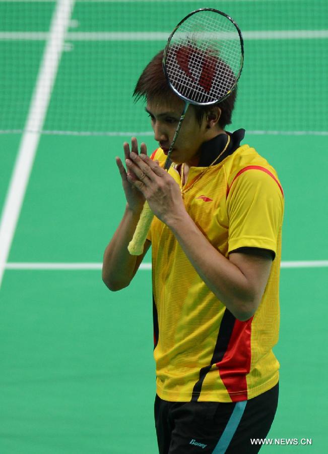 Tanongsak Saensomboonsuk of Thailand celebrates for victory after winning the men's singles gold medal match of badminton event against Gao Huan of China at the 27th Summer Universiade in Kazan, Russia, July 11, 2013. Tanongsak Saensomboonsuk won the gold medal with 2-0. (Xinhua/Kong Hui)