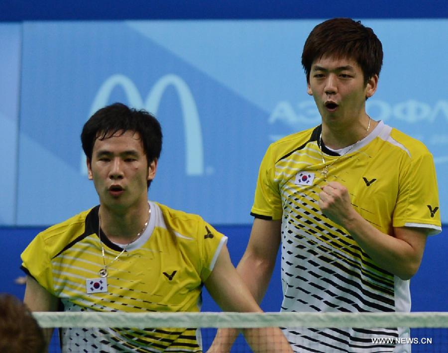 Lee Yong Dae (R) and Ko Sung Hyun of South Korea celebrate during the men's doubles final match of badminton event against Ivan Sozonov and Vladimir Ivanov of Russia at the 27th Summer Universiade in Kazan, Russia, July 11, 2013. Lee Yong Dae and Ko Sung Hyun won the gold medal with 3-0. (Xinhua/Kong Hui) 