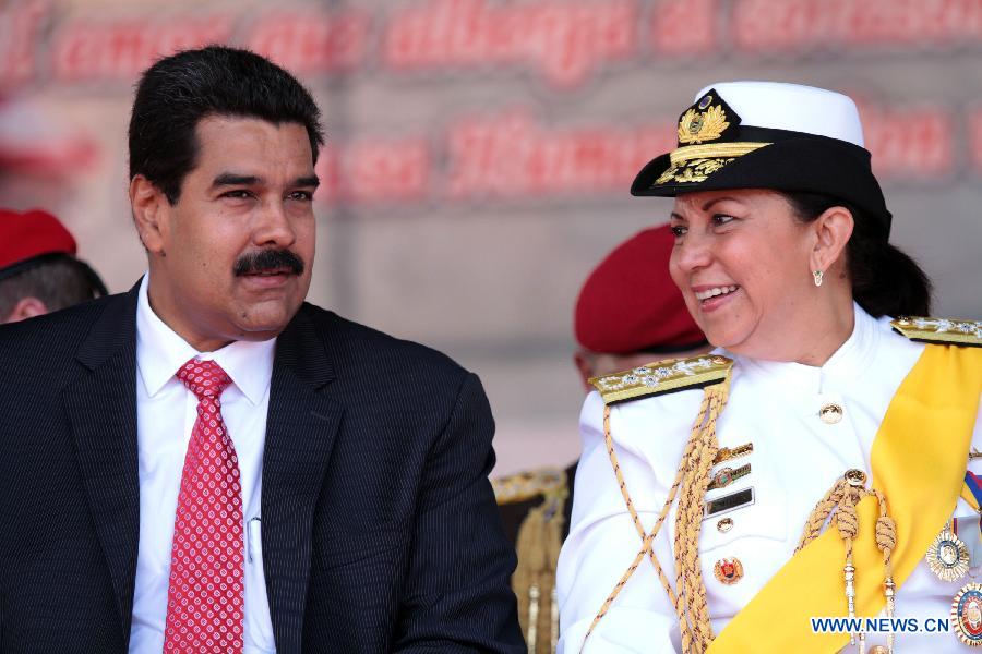 Venezuelan President, Nicolas Maduro (L) talks with Defense Minister Carmen Melendez in the National Bolivarian Armed Forces military commands transmission ceremony at the Honor Courtyard of the Military Academy, in Caracas, Venezuela, on July 11, 2013. (Xinhua/AVN)