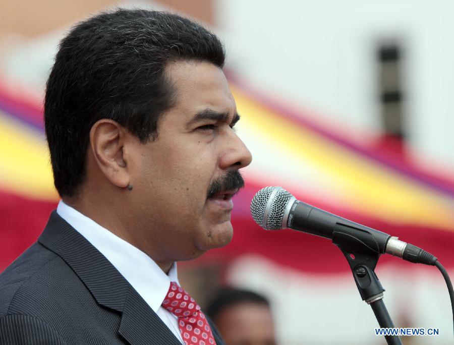 Venezuelan President Nicolas Maduro delivers a speech in the National Bolivarian Armed Forces military commands transmission ceremony at the Honor Courtyard of the Military Academy, in Caracas, Venezuela, on July 11, 2013. (Xinhua/AVN)