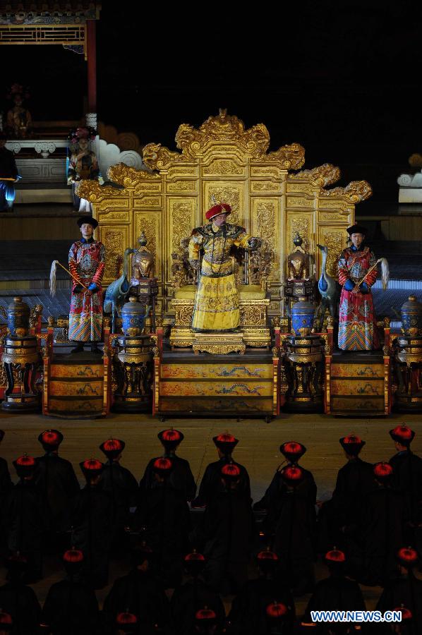 Kangxi ceremony is performed in Chengde, north China's Hebei Province, July 11, 2013. The show depicts the stories of Kangxi (1654-1722), the fourth emperor of ancient China's Qing Dynasty (1644-1911). During the reign of Kangxi, China witnessed a strong and prosperous period. Kangxi ceremony has run for 218 performances and has drwan nearly 200,000 viewers since its premiere in June 2011. (Xinhua/Wang Min)