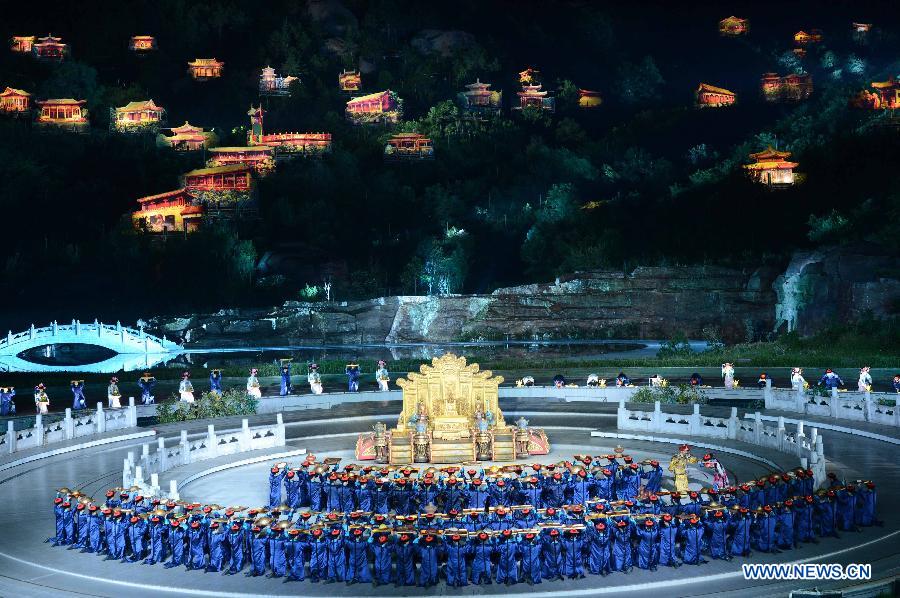 Kangxi ceremony is performed in Chengde, north China's Hebei Province, July 11, 2013. The show depicts the stories of Kangxi (1654-1722), the fourth emperor of ancient China's Qing Dynasty (1644-1911). During the reign of Kangxi, China witnessed a strong and prosperous period. Kangxi ceremony has run for 218 performances and has drwan nearly 200,000 viewers since its premiere in June 2011. (Xinhua/Wang Min)