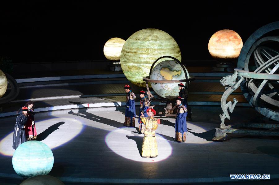 Kangxi ceremony is performed in Chengde, north China's Hebei Province, July 11, 2013. The show depicts the stories of Kangxi (1654-1722), the fourth emperor of ancient China's Qing Dynasty (1644-1911). During the reign of Kangxi, China witnessed a strong and prosperous period. Kangxi ceremony has run for 218 performances and has drwan nearly 200,000 viewers since its premiere in June 2011. (Xinhua/Wang Min)