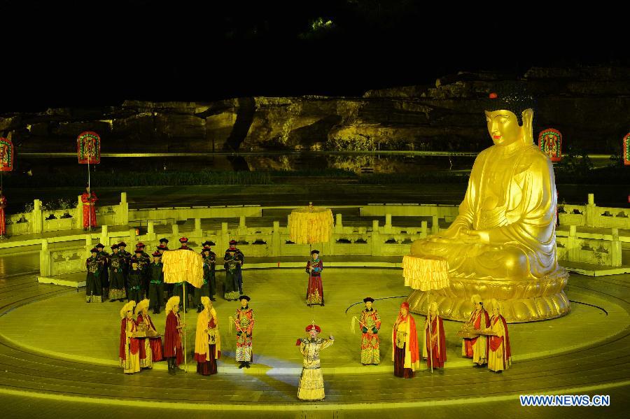 Kangxi ceremony is performed in Chengde, north China's Hebei Province, July 11, 2013. The show depicts the stories of Kangxi (1654-1722), the fourth emperor of ancient China's Qing Dynasty (1644-1911). During the reign of Kangxi, China witnessed a strong and prosperous period. Kangxi ceremony has run for 218 performances and has drwan nearly 200,000 viewers since its premiere in June 2011. (Xinhua/Wang Min)