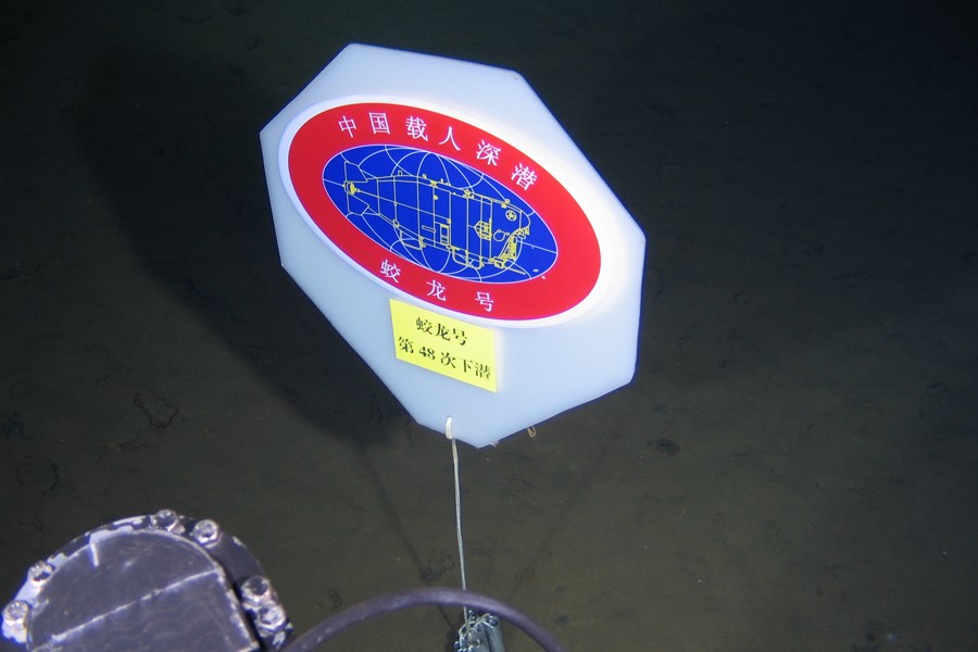 The Jiaolong has completed its third experimental dive and returns safely to its mother ship on June 22. It reached maximum depth of 6,963 meters, and collected three water samples, and three sediments samples. It also took photos of seafloor creatures. (Xinhua News Agency/Zhang Xudong)