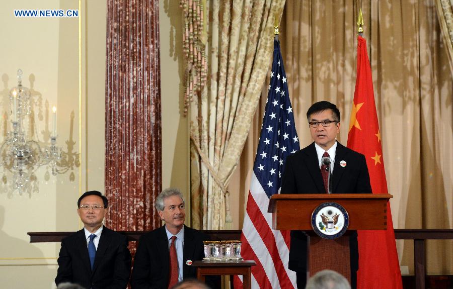 Yang Jiechi (1st L), Chinese State Councilor and special representative of Chinese President Xi Jinping, together with U.S. Deputy Secretary of State William Burns (2nd L), listens to U.S. Ambassador to China Gary Faye Locke at a signing ceremony of China-U.S. EcoPartnership program in Washington, the United States, July 11, 2013. China and the United Sates on Thursday expanded their EcoPartnership program with the signing of six new partnerships to reduce greenhouse gases emissions and improve energy efficiency as well as to create jobs. (Xinhua/Wang Lei)