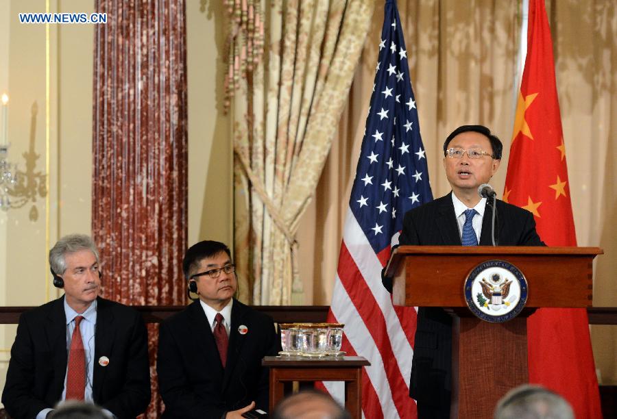 Yang Jiechi (R), Chinese State Councilor and special representative of Chinese President Xi Jinping, addresses a signing ceremony of China-U.S. EcoPartnership program in Washington, the United States, July 11, 2013. China and the United Sates on Thursday expanded their EcoPartnership program with the signing of six new partnerships to reduce greenhouse gases emissions and improve energy efficiency as well as to create jobs. (Xinhua/Wang Lei)