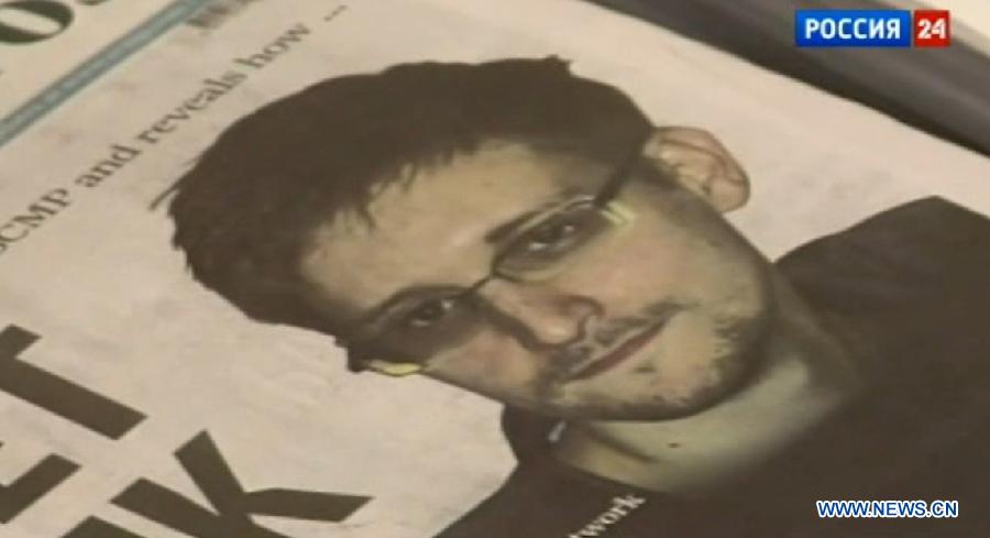 The video clip of Russia's national TV news program on July 12, 2013 shows a picture of former U.S. spy agency contractor Edward Snowden in Moscow, Russia. Edward Snowden planned to meet Russian activists, lawyers as well as representatives from other organizations on Friday, the Interfax news agency reported. (Xinhua/Jiang Kehong)