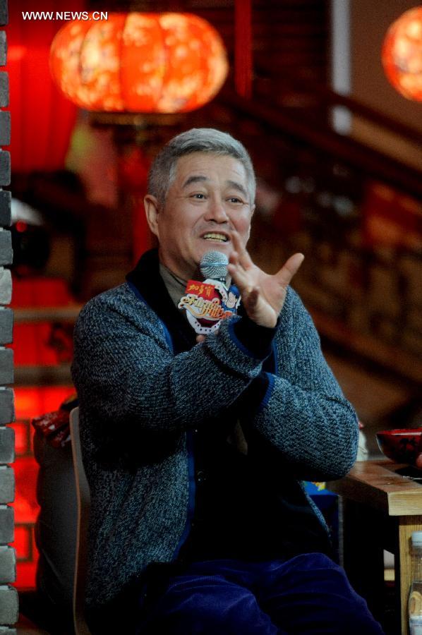 File photo taken on Dec. 15, 2012 shows comedian Zhao Benshan gesturing while commenting on his apprentices' performances in a TV show. Chinese well-known director Feng Xiaogang will be the general director of China Central Television (CCTV)'s 2014 Spring Festival Gala, CCTV announced on July 12, 2013. Zhao Benshan will be deputy general director in charge of the gala's comedy programming. (Xinhua)