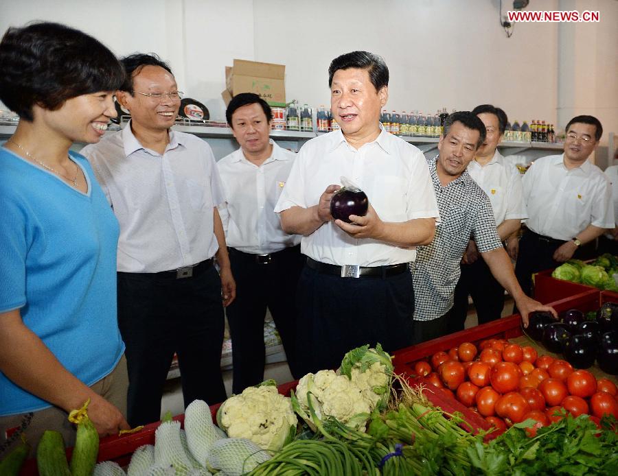 Chinese President Xi Jinping (4th L) talks with villagers shopping at a supermarket in Tayuanzhuang Village of Zhengding County, north China's Hebei Province. Xi made an inspection tour of Hebei Province from July 11 to 12. (Xinhua/Li Tao) 