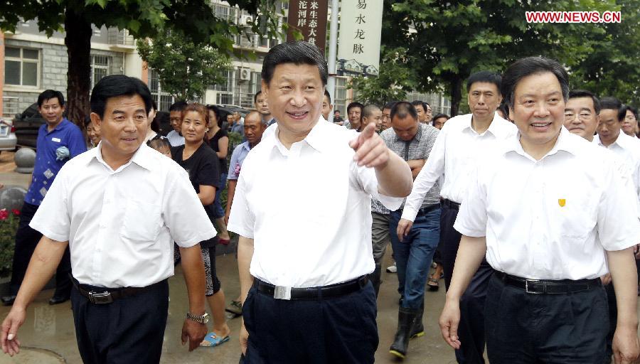 Chinese President Xi Jinping (C front) visits cadres and villagers of Tayuanzhuang Village in Zhengding County, north China's Hebei Province. Xi made an inspection tour of Hebei Province from July 11 to 12. (Xinhua/Ju Peng)