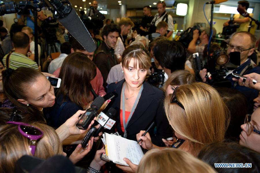 A press officer of Moscow's Sheremetyevo International Airport receives interviews at Terminal F, on July 12, 2013. Former U.S. spy agency contractor Edward Snowden planned to meet with Russian activists, lawyers as well as representatives from other organizations on Friday, Moscow's Sheremetyevo airport authority confirmed. (Xinhua/Jiang Kehong) 