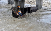 Workers restore bridge's damage caused by flood