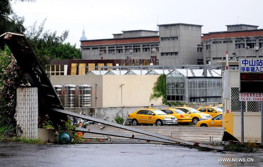 The entrance of a parking lot was damaged in Taipei, southeast China's Taiwan, July 13, 2013. One person has been confirmed dead and 21 others injured as Typhoon Soulik hit the city on early Saturday morning. (Xinhua/Tao Ming) 