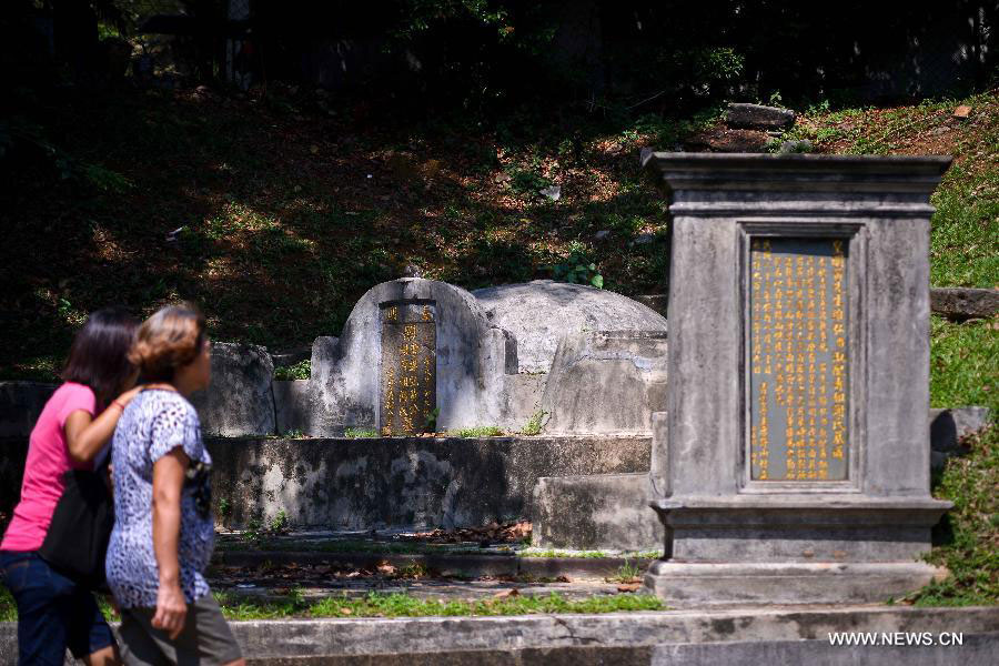Photo taken on July 12, 2013 shows an ancient tomb of a Chinese in Melaka, Malaysia. Melaka and George Town, historic cities of the Straits of Malacca, were inscribed onto the list of UNESCO World Heritage Site in July 2008. (Xinhua/Chong Voon Chung)