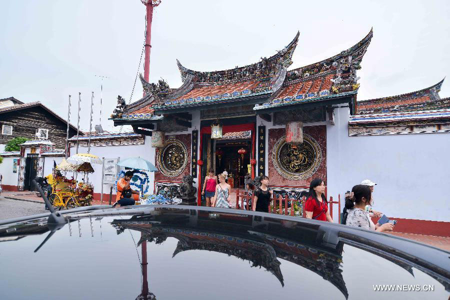 Photo taken on July 12, 2013 shows a temple at China Town in Melaka, Malaysia. Melaka and George Town, historic cities of the Straits of Malacca, were inscribed onto the list of UNESCO World Heritage Site in July 2008. (Xinhua/Chong Voon Chung) 