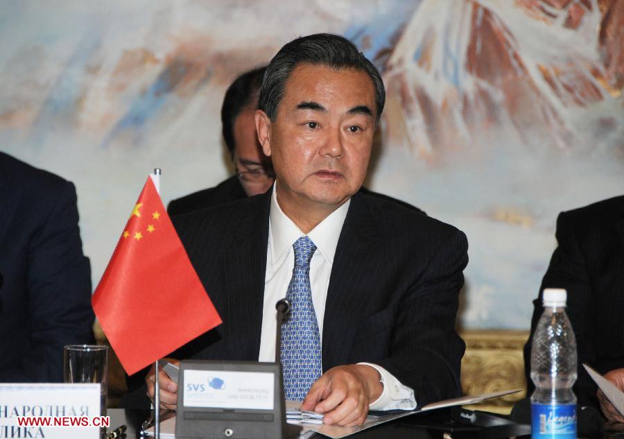 Chinese Foreign Minister Wang Yi attends a meeting of the Council of Foreign Ministers of the Shanghai Cooperation Organization (SCO) in Cholpon-Ata, Kyrgyzstan, July 13, 2013.(Xinhua/Guan Jianwu)