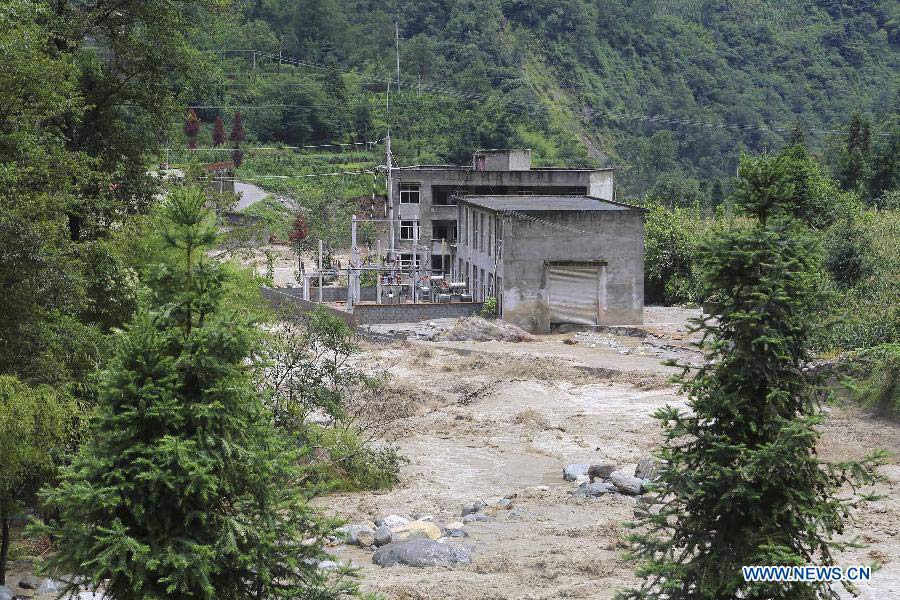 Photo taken on July 13, 2013 shows a waterlogged power station in Caoke Township of Shimian County in Ya'an City, southwest China's Sichuan Province. Rainstorms and floods hit Shimian County early Saturday, affecting many townships, among which Caoke Township suffered disconnection in transport, communication and electricity. No casualties have been reported yet. (Xinhua/Zhou Wanlong)