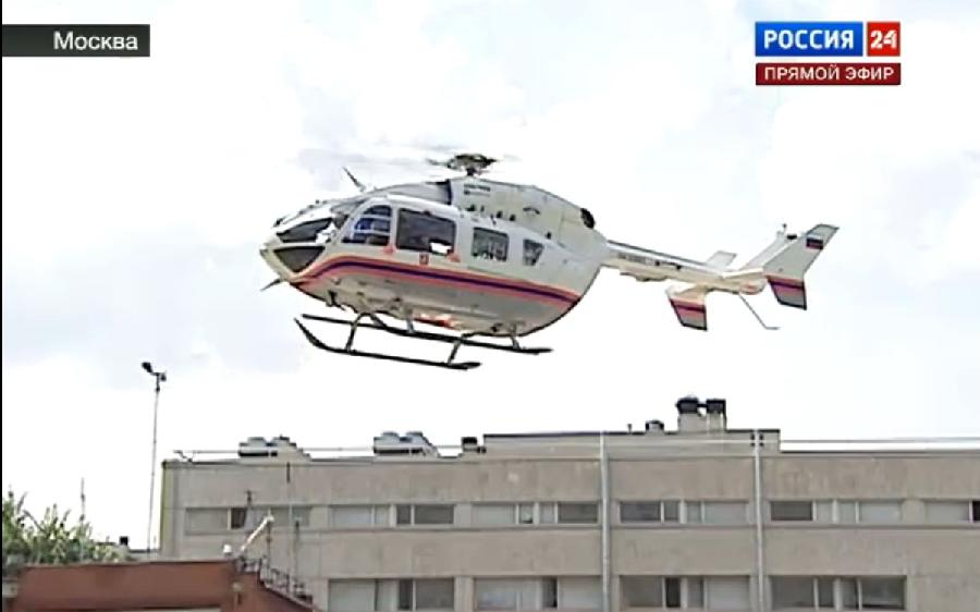 This TV screen grab of Russia 24 channel shows a rescue helicopter hurrying to crash accident site in Moscow, Russia, on July 13, 2013. At least 15 people were killed and dozens injured on Saturday when a truck crashed into a bus in Moscow, the Emergency Situations Ministry said. (Xinhua) 