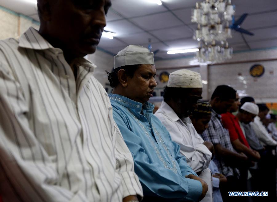 Muslims pray at a mosque during the holy month of Ramadan in Yangon, Myanmar, on July 13, 2013. Muslims throughout the world are celebrating the holy fasting month of Ramadan. (Xinhua/U Aung) 