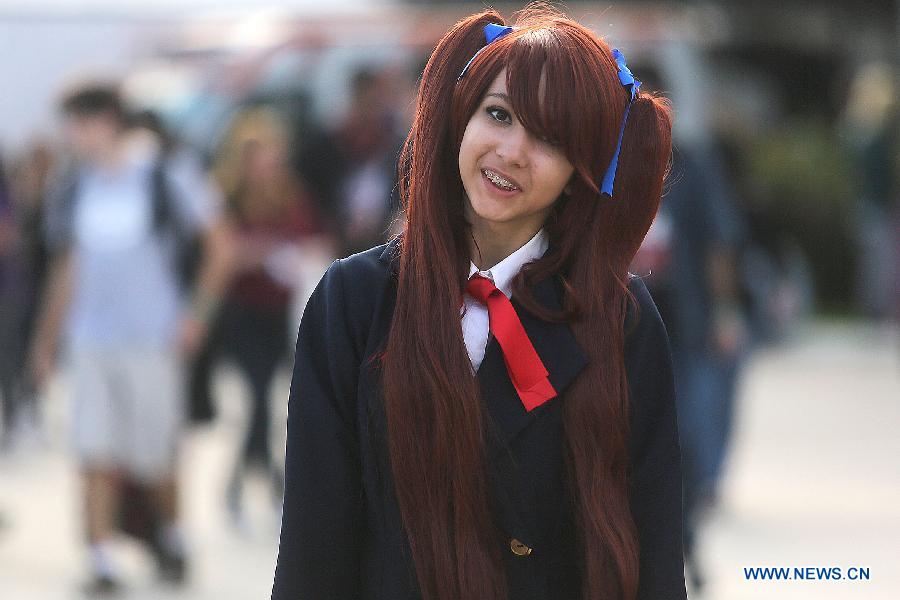 A fan dressed up as a cartoon character attends the 10th "Anime Friends" convention, in Sao Paulo, Brazil, on July 13, 2013. (Xinhua/Rahel Patrasso)