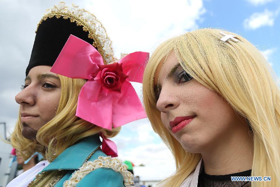 Fans dressed up as cartoon characters attend the 10th "Anime Friends" convention, in Sao Paulo, Brazil, on July 13, 2013. (Xinhua/Rahel Patrasso) 
