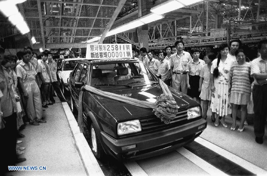 File photo taken on Aug. 1, 1994 shows the first sedan by the China-German joint venture automotive manufacturer FAW-VW rolling off the assembling line in Changchun, capital of northeast China's Jilin Province. (Xinhua)