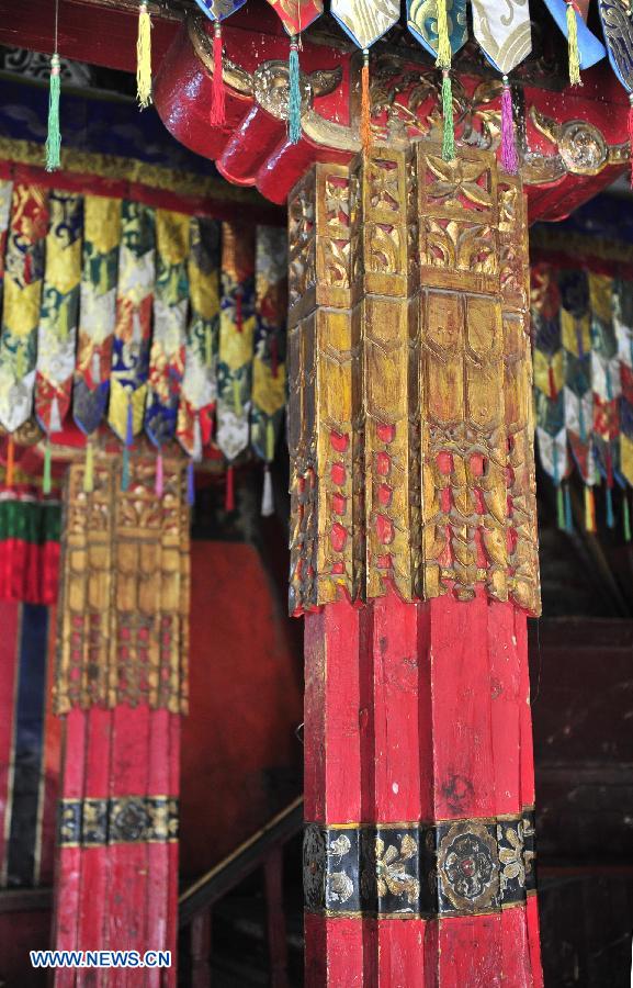 Photo taken on July 10, 2013 shows a painted pillar at the main hall of the Tsurpu Monastery in Doilungdeqen County, southwest China's Tibet Autonomous Region. Founded in 1189, Tsurpu serves as the traditional seat of the Karma Kagyupa, or "White Hat Sect," of Tibetan Buddhism. (Xinhua/Liu Kun)