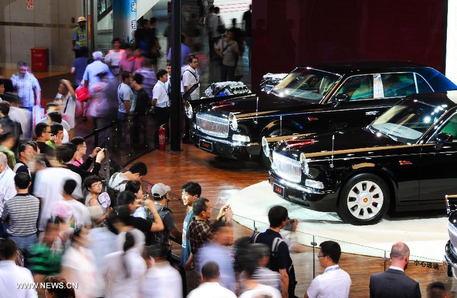 File photo taken on July 13, 2013 shows Hongqi limousines at the pavilion of the First Automotive Works Group (FAW) at an auto exhibition in Changchun, capital of northeast China's Jilin Province.  (Xinhua)