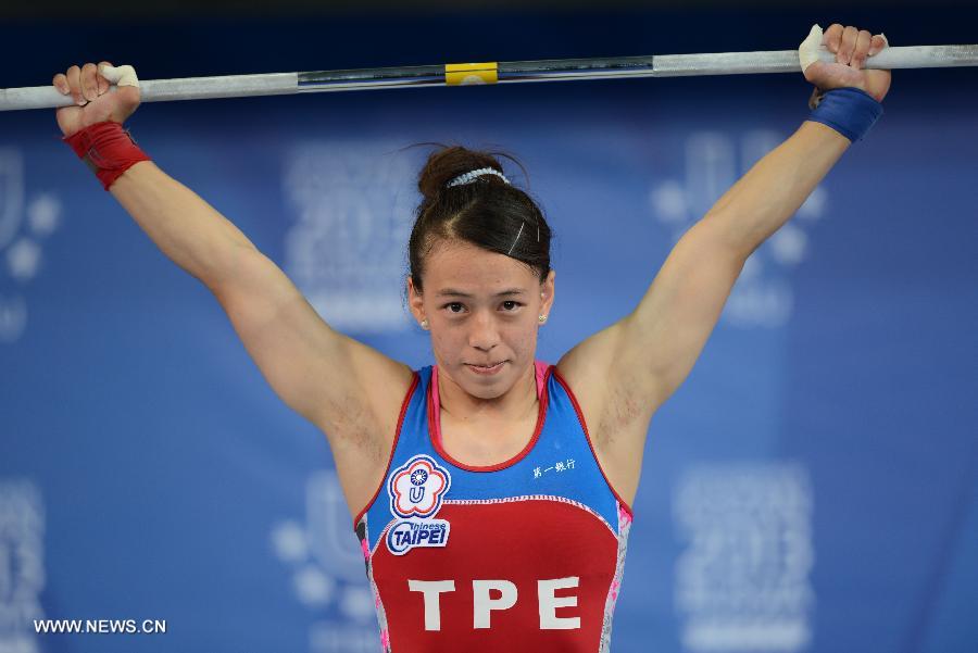 Kuo Hsing-chun of Chinese Taipei competes during the women's 58kg final of weightlifting event at the 27th Summer Universiade at the Ak Bure Multipurpose Sports Complex in Kazan, Russia, July 8, 2013. Kuo Hsing-chun won the gold medal and created the new Universiade record of the event with 238kg. She also created the new universiade snatch and clean & jerk records with 104kg and 134kg. (Xinhua/Kong Hui)