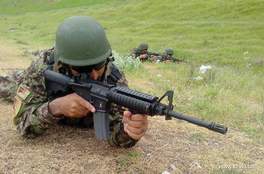 An Afghan Army soldier takes position during an operation against Taliban fighters in Badakhshan province in northeast Afghanistan on July 9, 2013. 38 Taliban militants have been killed in security operations across Afghanistan within the last 24 hours, said the country's Interior Ministry Tuesday morning. (Xinhua/Azorda)