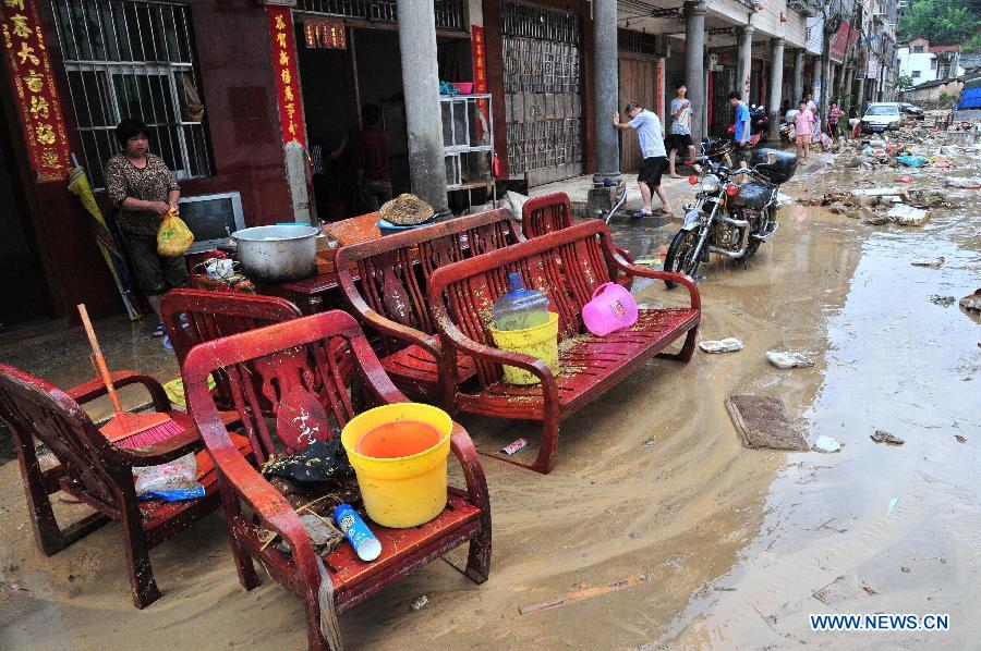 Photo taken on July 14, 2013 shows the waterlogged Zhaoji Street in Shatian Township in Meizhou City, south China's Guangdong Province. Typhoon Soulik-triggered rainstorms battered Meizhou from Saturday night, flooding many roads and farmlands. (Xinhua/Zhong Xiaofeng)