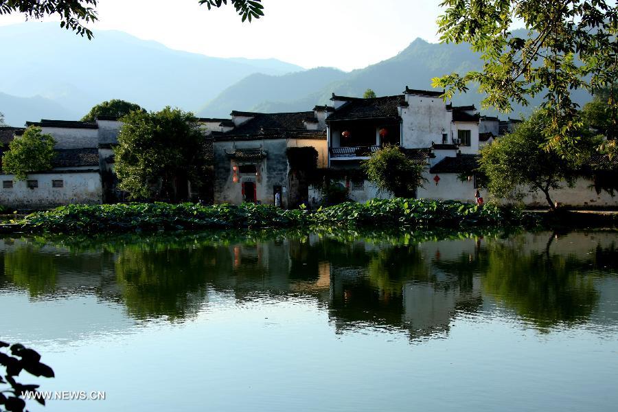 Photo taken on July 9, 2013 shows the scenery of Hongcun Village, known as "a village in the Chinese painting", in Yixian County of Huangshan City, east China's Anhui Province. (Xinhua/Shi Guangde) 