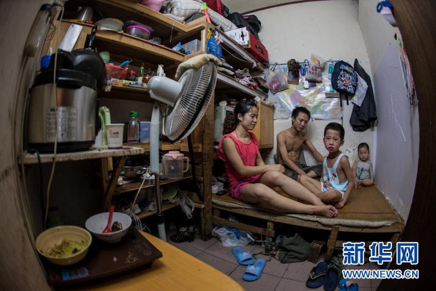 4 square meters house: A room of 4 square meters can also hold a complete family - a family of a couple, a family of 3, evens a family of 4. The family of Liu Jiezhang once lived in a room of 4 square meters hidden in a building near the Renmin Road in the center of Changsha in July 2011. Nearly 190 families of immigrant workers lived in the building at its prosperous time, most of them squeezed in a room of 4 square meters like Liu Jiezhang. (Photo/Xinhua)