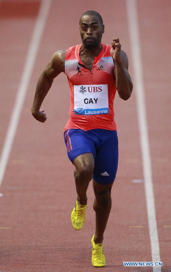 Tyson Gay of the U.S. runs during the 100m event of the Lausanne Diamond League meeting in Lausanne, July 4, 2013.  Track and field was dealt with a huge blow Sunday when the world's top sprinters failed drug tests. They are former world record holder Jamaican Asafa Powell, American champion Tyson Gay and Olympic medalist Sherone Simpson. (Xinhua/Reuter Photos)