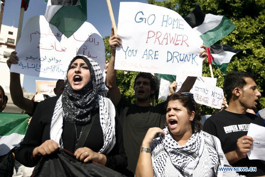 Palestinians take part in a protest in Gaza against Israeli plan to relocate Bedouins in the Negev desert on July 15, 2013. Thousands of Palestinians take part in protests against the plan to settle tens of thousands of their desert-dwelling people in permanent townships, media reported. There are around 260,000 Bedouin in Israel. (Xinhua/Stringer)